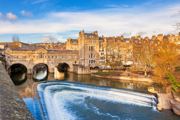 Pulteney Bridge and River Avon in Bath England UK Stock photograph of Pulteney Bridge above River Avon in Bath, England, United Kingdom on a sunny day. bath england photos stock pictures, royalty-free photos & images