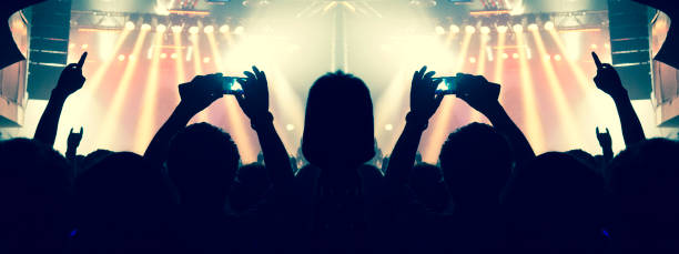 istock Filming concert on smart phone 1186188124