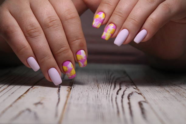 istock glamorous beautiful manicure on a trendy texture 1186188274