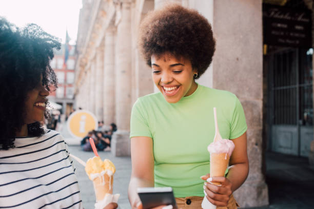 istock Mixed race girls eating ice cream 1186189518