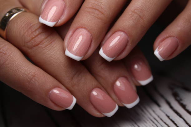 istock Beautiful nail design on female hands on background. 1186190300
