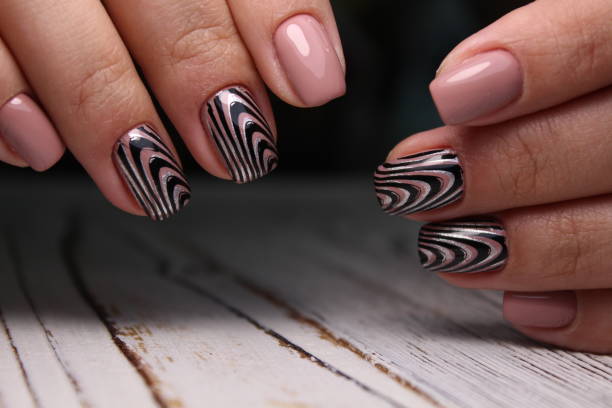 istock sexy pink manicure on long beautiful nails 1186190375