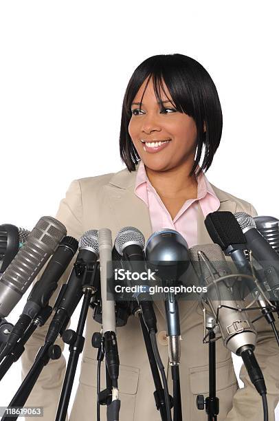 Woman In Front Of Microphones Stock Photo - Download Image Now - Women, Press Conference, One Woman Only
