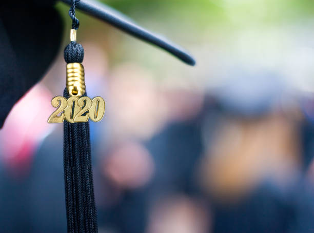 Class of 2020 Graduation Ceremony Tassel Black Closeup of a 2020 Graduation Tassel at a graduation ceremony. 2020 stock pictures, royalty-free photos & images