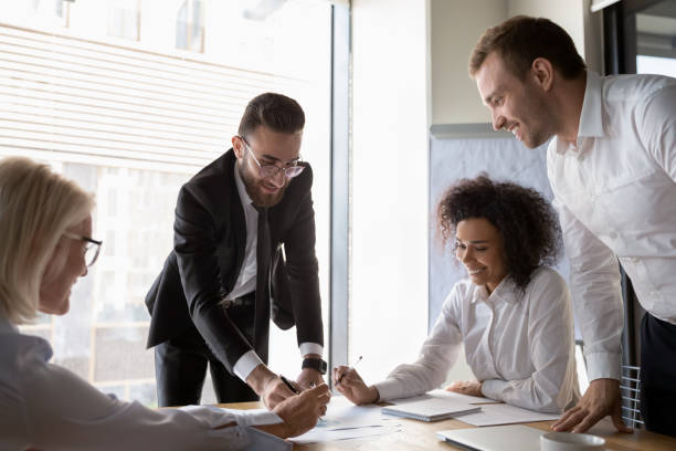 istock Arab ceo and diverse corporate partners managing company finances 1186193629