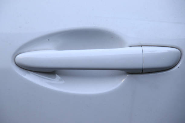 istock Close up of White car door handle 1186196323
