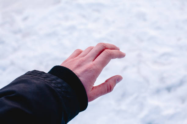 Risk of frostbite of hand because of frost in winter stock photo