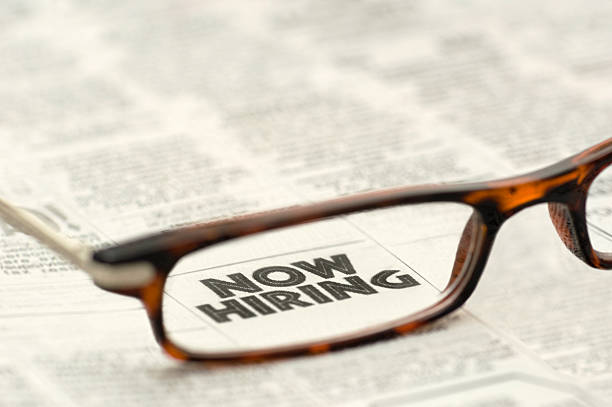 istock Now Hiring classified ad framed in glasses 118620324