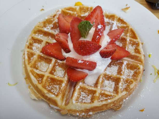 istock Waffle With Strawberry On White Ceramic Plate 1186203418