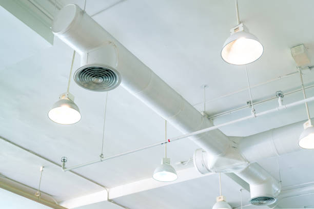 istock Air duct, air conditioner pipe and fire sprinkler system on white ceiling wall. Air flow and ventilation system. Building interior. Ceiling lamp light with opened light. Interior architecture concept. 1186207384