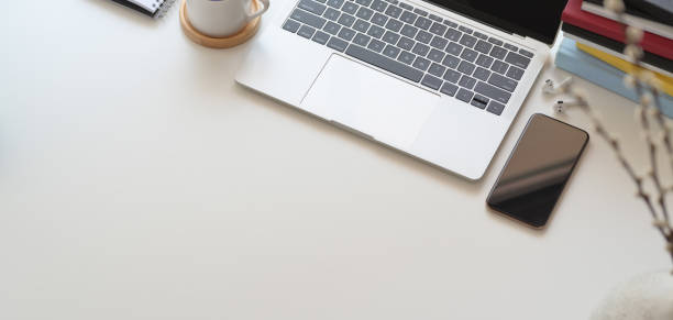 istock Top view of comfortable workspace with laptop computer and office supplies 1186211970