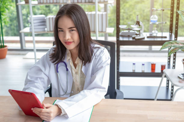 istock A beautiful doctor using a laptop in the office 1186215654