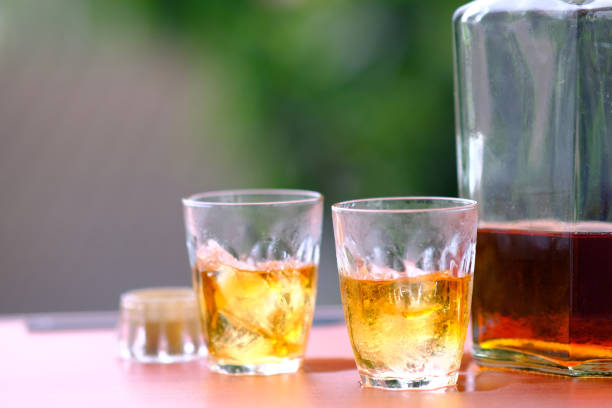 istock Close up whisky on wooden background 1186220418