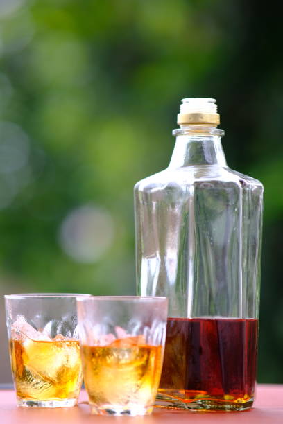 istock Whisky on wooden background 1186220453
