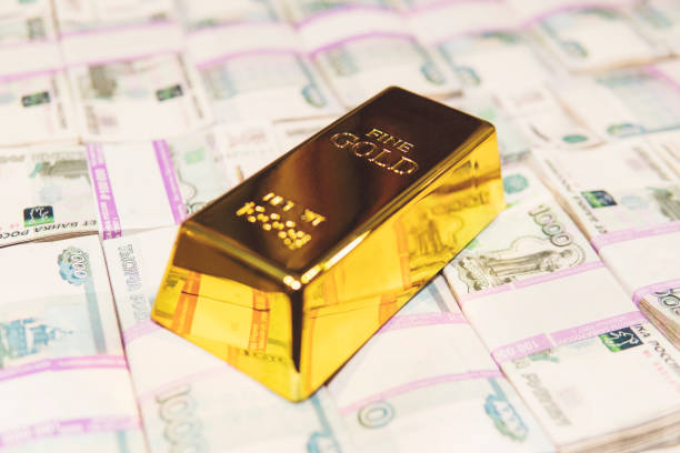 istock gold bar on russian money background 1000 rubles banknotes 1186225855