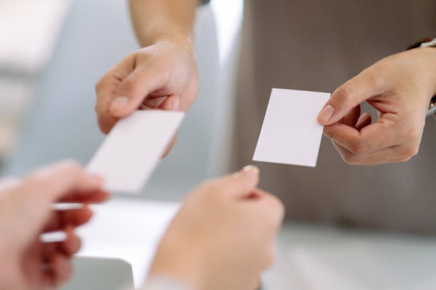 istock businessman holding and exchanging empty business card 1186231289