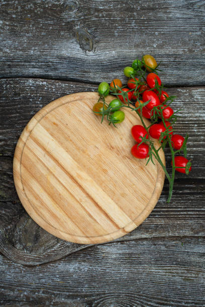 istock beautiful tomatoes on wooden surface 1186232192