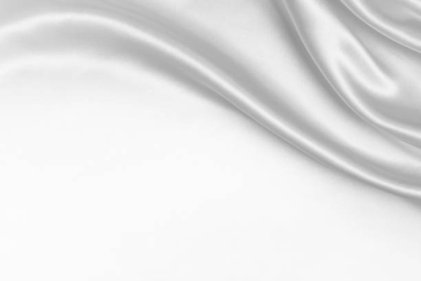 White Silk Wavy Texture Background White Silk Wavy Texture Background. textured silver flowing wave pattern stock pictures, royalty-free photos & images