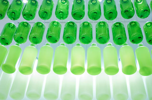 istock Many green glasses empty bottles with bright light up background, beautiful green bottles glasses textured range from soft to hard level. 1186237642