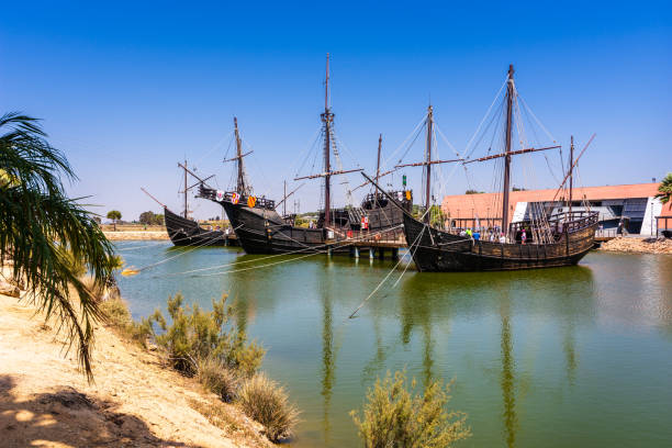 Replicas of Christopher Columbus's boats: the Niña, the Pinta, and the Santa María in Palos de la Frontera, Spain View of the three ships from across the water. Wharf of the Caravels (Spanish: Muelle de las Carabelas) is a museum in Palos de la Frontera, in the province of Huelva, Andalusia, Spain. Replicas of Christopher Columbus's boats: the Niña, the Pinta, and the Santa María are available for tourists to explore. They were used for his first voyage to the Americas. replica santa maria ship stock pictures, royalty-free photos & images