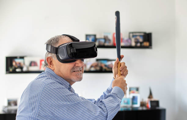 istock Elderly man plays soccer with virtual reality goggles 1186241465
