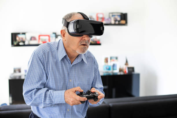 istock Elderly man plays soccer with virtual reality goggles 1186241483