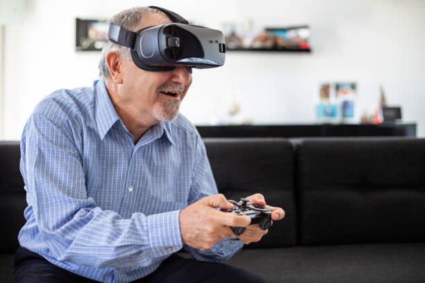 istock Elderly man plays soccer with virtual reality goggles 1186241484