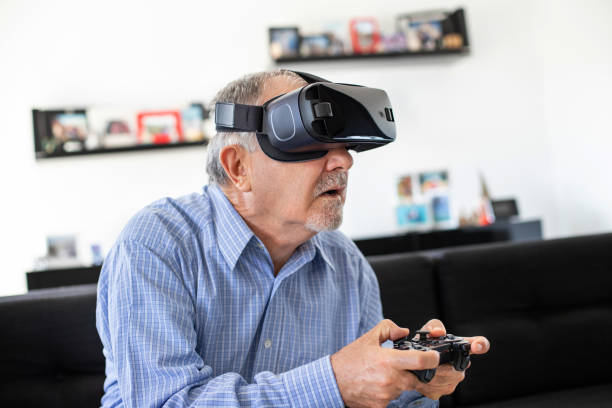 istock Elderly man plays soccer with virtual reality goggles 1186241507