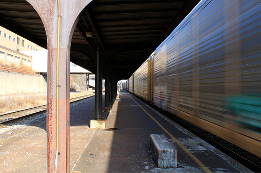 Akron, Ohio, USA - Dec.26.2009: CSX train passing abandoned Akron Railway Station.