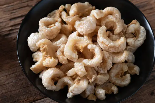 Photo of Pork rinds also known as chicharon or chicharrones , kab moo