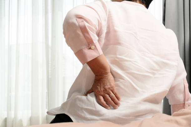 istock Old woman back pain at home, health problem concept 1186249259