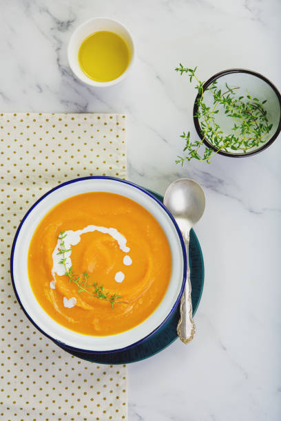 istock Pumpkin squash soup plated on the table. Copy space concept. 1186254780