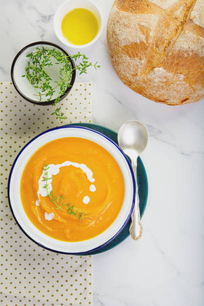 istock Pumpkin squash soup plated on the table. Copy space concept. 1186254848