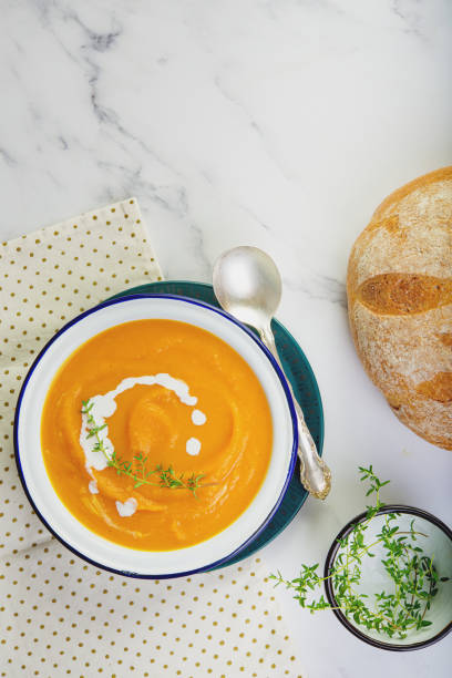 istock Pumpkin squash soup plated on the table. Copy space concept. 1186254931