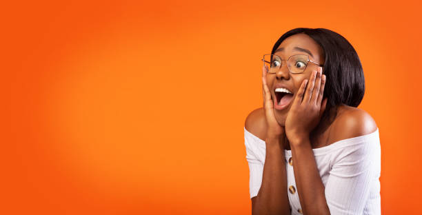 istock Surprised Woman Shouting With Hands On Cheeks Standing, Studio, Panorama 1186255666