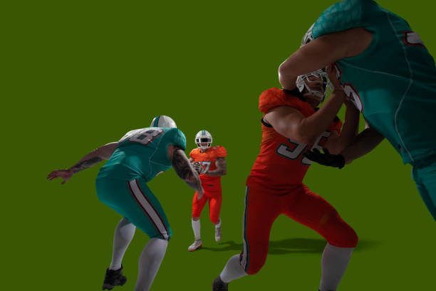 AMERICAN FOOTBALL American football players isolated on chroma key. football field night american culture empty stock pictures, royalty-free photos & images