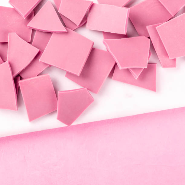 istock Ruby chocolate, square overhead shot on a pink background with a place for text 1186257284