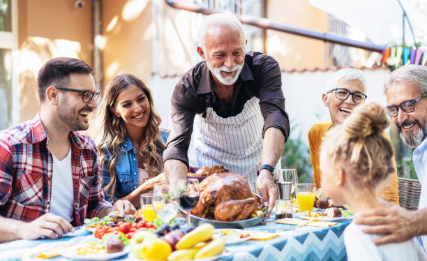 istock Happy family celebrating Thanksgiving day 1186257566