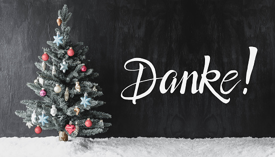 German Calligraphy Danke Means Thank You. Tree With Colorful Ball Ornament And Snow