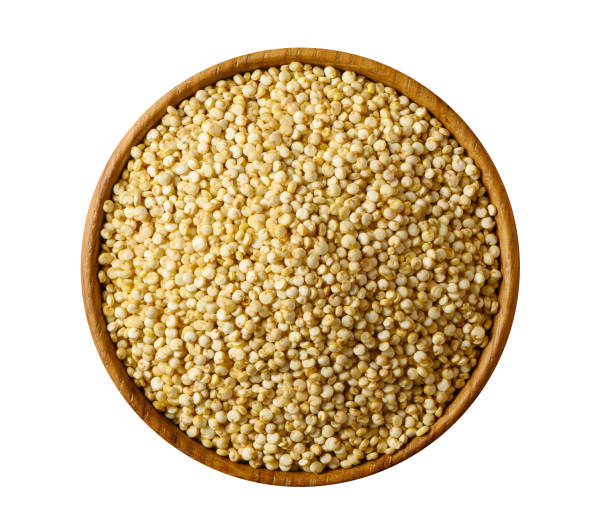 istock Quinoa seeds in wooden bowl on white. 1186262883