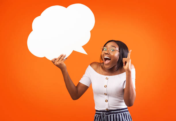 istock Afro Girl Holding Speech Bubble Pointing Finger Up, Studio, Mockup 1186268842