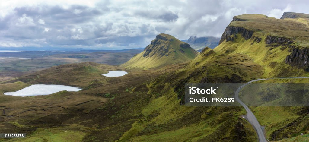 Panoramic image of spectacular scenery of The Quiraing on the Isle of Skye in summer , Scotland Quiraing Needle Stock Photo