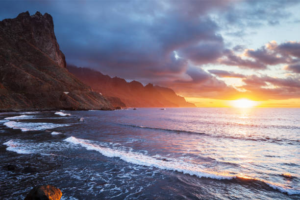 istock Scenery sunset at the beach near the cliff 1186274082