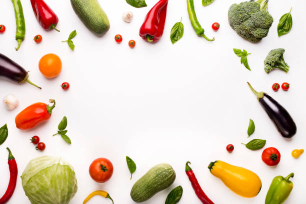 istock Frame of colored organic vegetables on white 1186275795