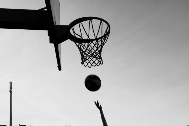 istock Playing basketball outdoors 1186280723