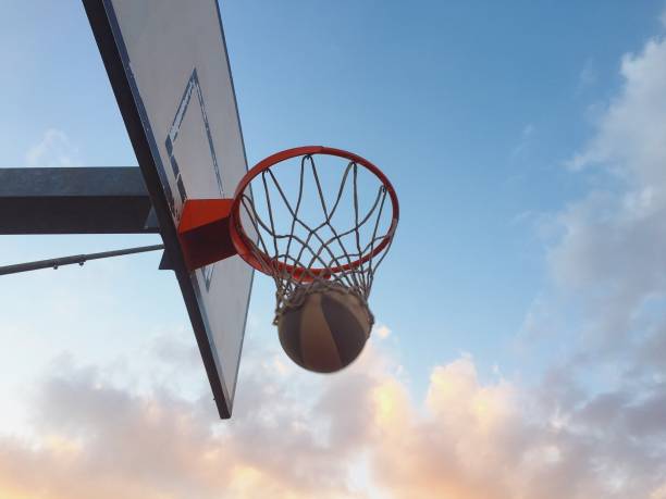 istock Playing basketball outdoors 1186280777