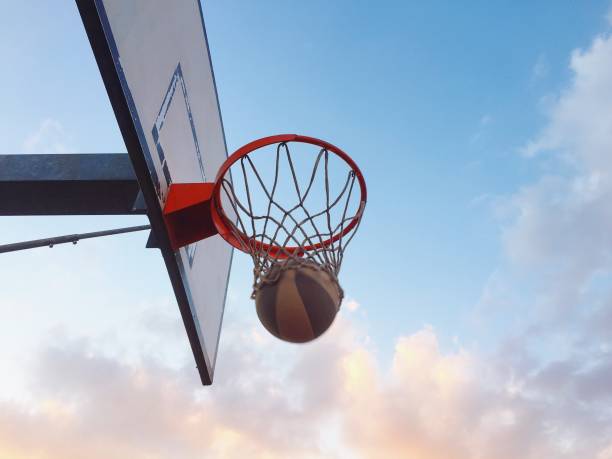 istock Playing basketball outdoors 1186281149