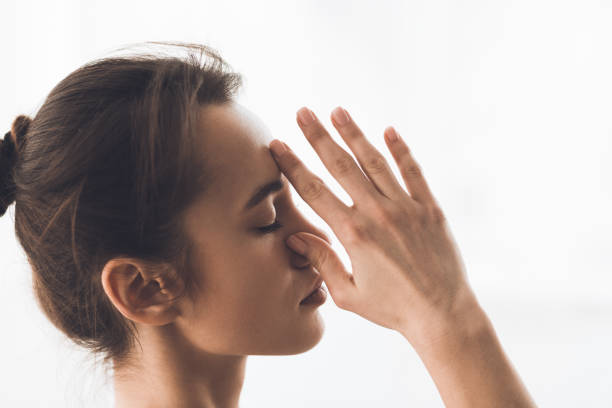 istock Relaxed woman meditating and doing breath exercise 1186282753