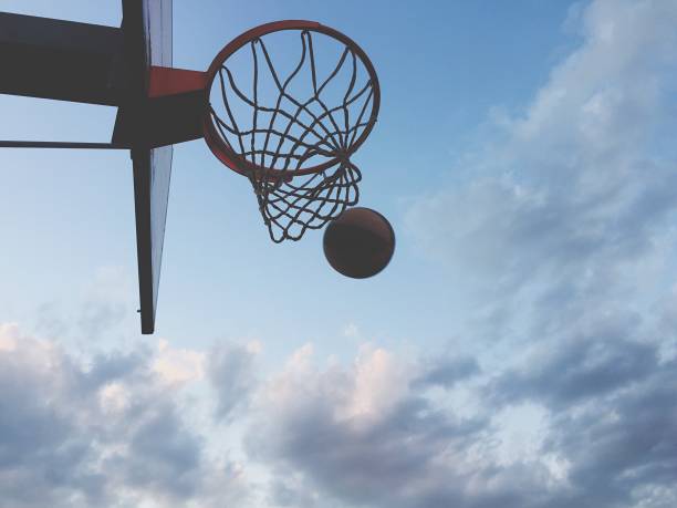istock Playing basketball outdoors 1186282822