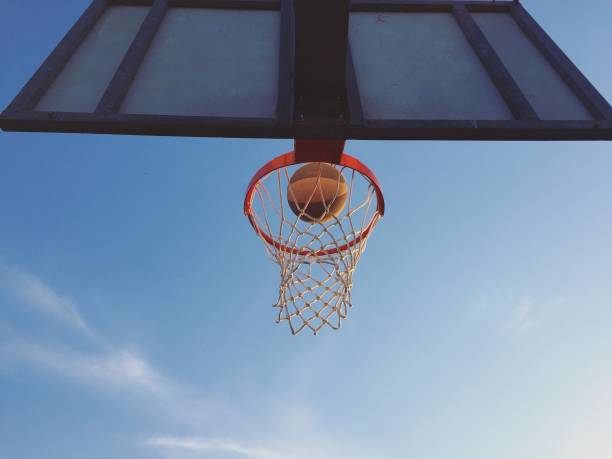 istock Playing basketball outdoors 1186282833